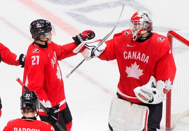 Canada's Kaiden Guhle and goalie Devon Levi celebrate their 3-0 win over the Czech Republic during IIHF World Junior Hockey Championship action in Edmonton on Saturday. Levi and Team Canada did it again in a semifinal playoff Monday shutting out Russia 5-0 to advance to Tuesday's gold-medal game.