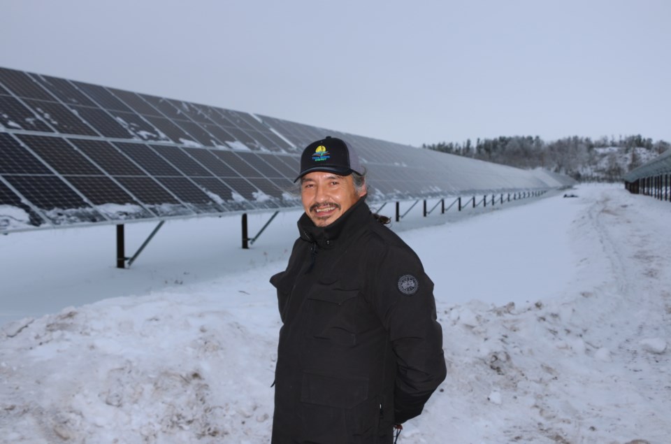 Chief Allan Adam of Athabasca Chipewyan First Nation with solar grid. | Three Nations Energy GP. Inc