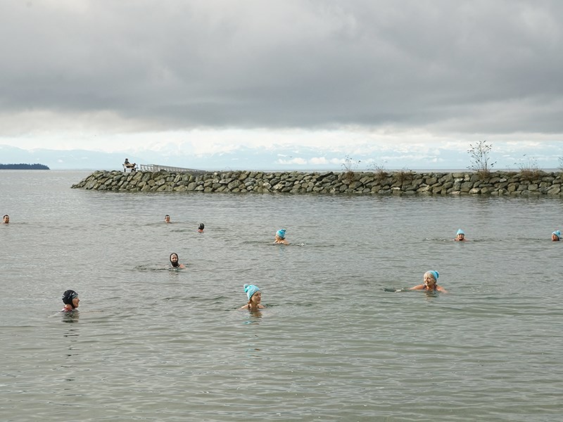 MAKING A SPLASH: An intrepid group of swimmers gathers daily at Willingdon Beach for a daily dip for the fun and health of it. Paul Galinski photo.