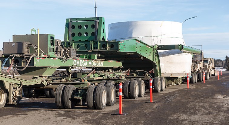 The convoy carrying a 170-tonne turbine runner sits in a parking lot just outside of Vanderhoof on Wednesday afternoon on its way to the Site C dam. The runner is one of six that will be used in the hydroelectric project. Citizen Photo by James Doyle/Local Journalism Initiative