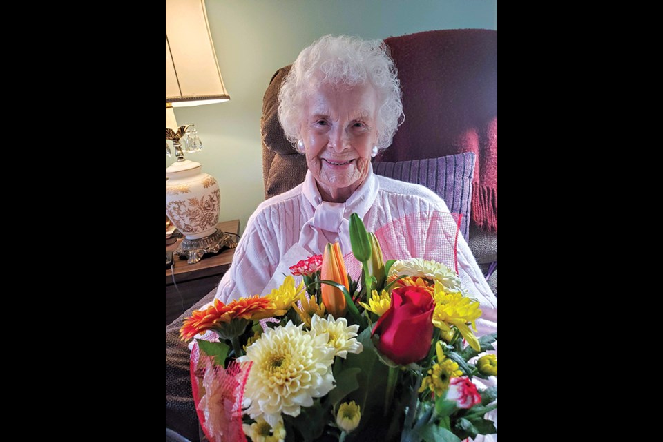 Doreen (Dody) Grant with flowers at her home on her birthday, Jan. 7.