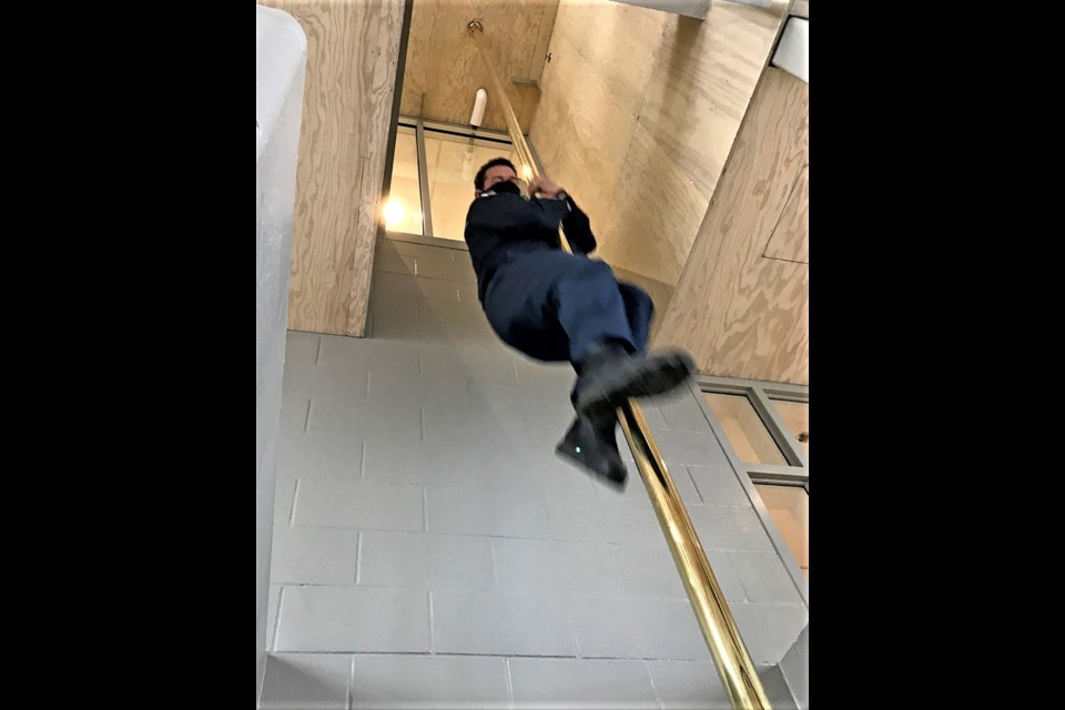 Prince George Fire Rescue acting lieutenant Jason Smith takes his turn sliding down the pole at the new No. 1 fire hall. Firefighters moved into the $17 million facility Saturday afternoon.