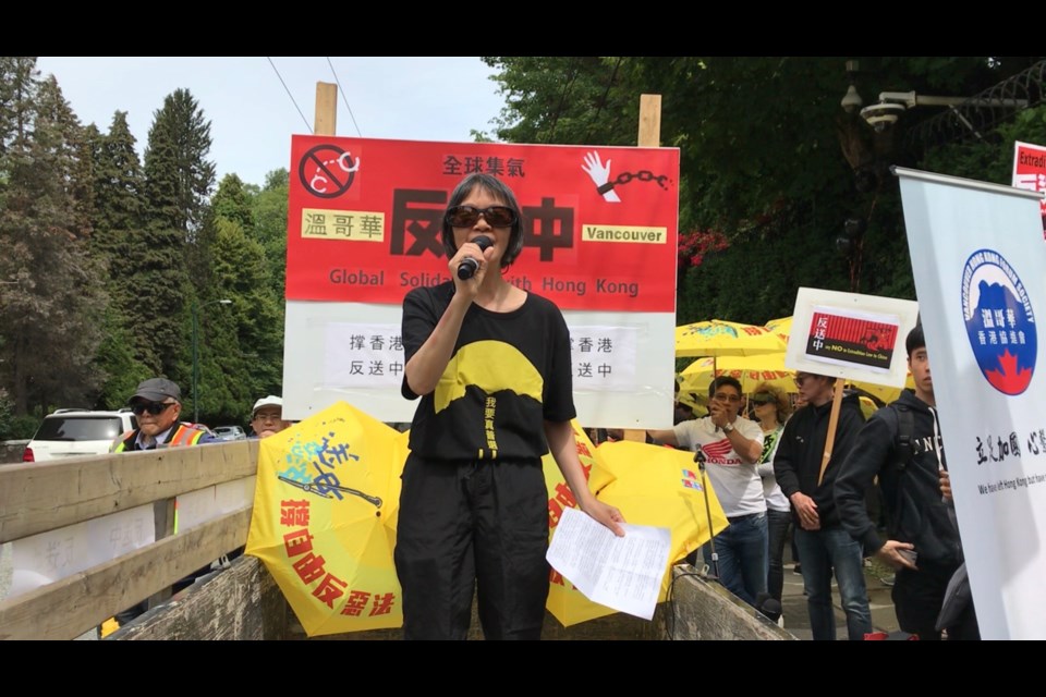 Ivy Li, a core member of Canadian Friends for Hong Kong, a pro-democracy group, demonstrates outside the PRC Consulate General in an undated photo