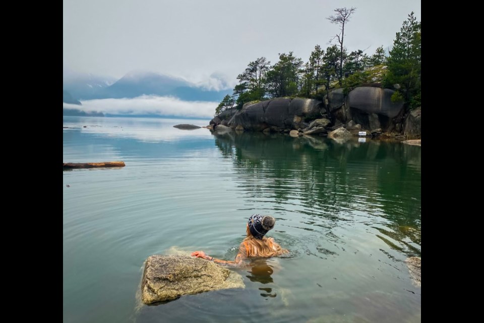 Plenty of folks in Squamish have taken up cold water swims, especially during the pandemic, including Yana Roney, seen here taking the plunge.