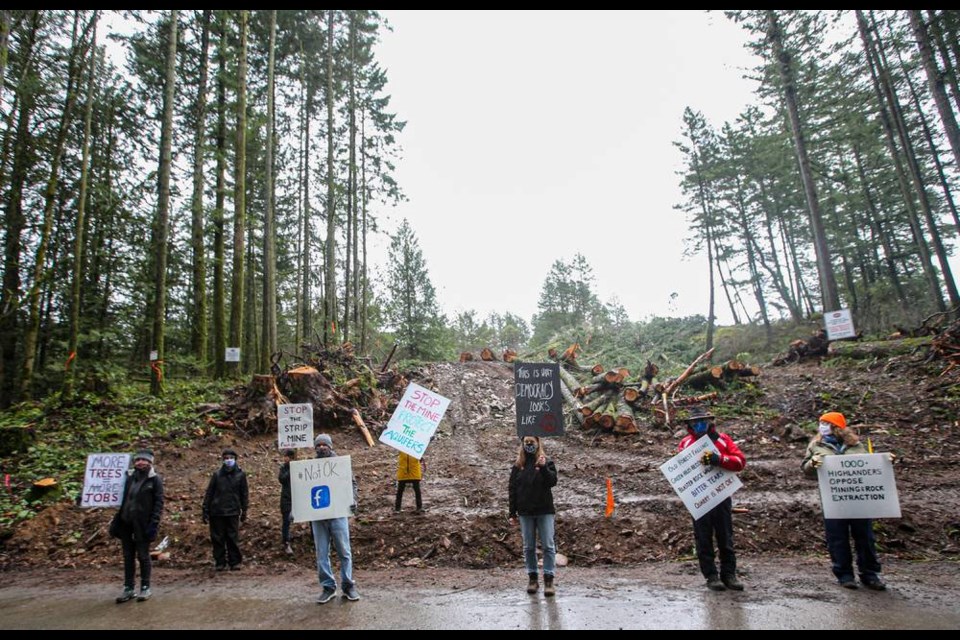 People protest at the entrance to one of the new roadways into the OK Industries site along Millstream Road in Highlands on Tuesday, Feb. 2, 2021. ADRIAN LAM, TIMES COLONIST