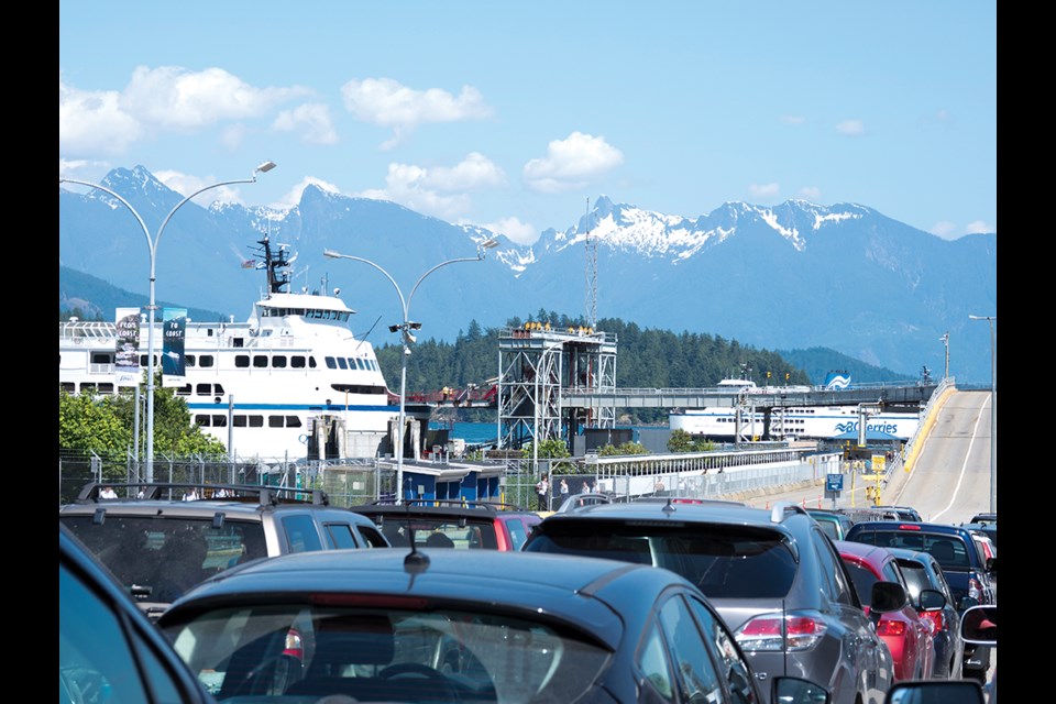 Vehicles wait to board Queen of Surrey at BC Ferries’ Langdale terminal.