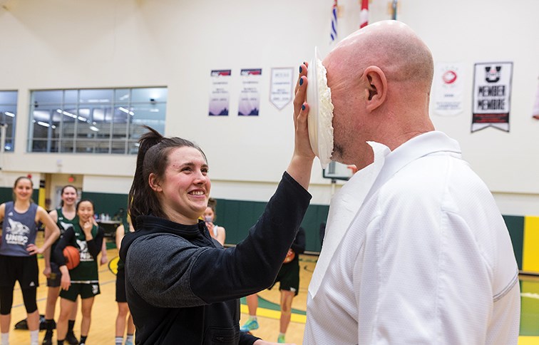 Citizen Photo by James Doyle/Local Journalism Initiative. 5th-year UNBC Timberwolves women's basketball player Madison Landry pies head coach Sergey Shchepotkin on Monday night at Northern Sport Centre.