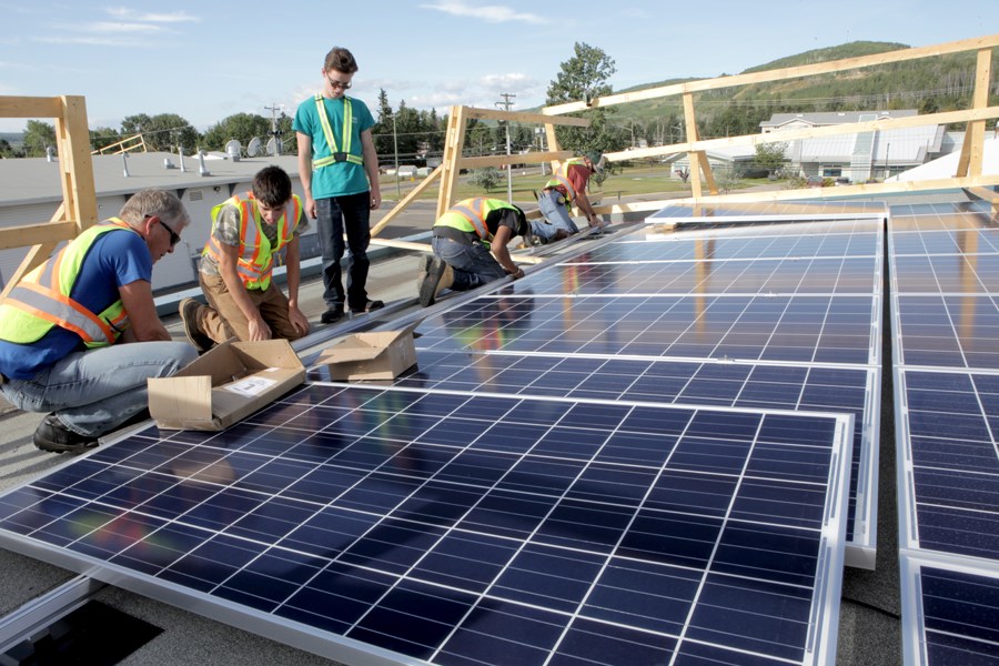 Solar panels being installed in Hudson's Hope. Silicon-based solar panels, shown at right, are the most common in use today.