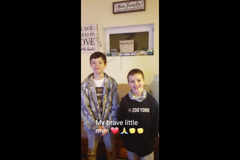 Jesse Johnson, 11, and his eight-year-old brother, Wyatt, who was inside his dad’s truck when it was stolen from a gas station in Qualicum Beach on Thursday. AARON JOHNSON