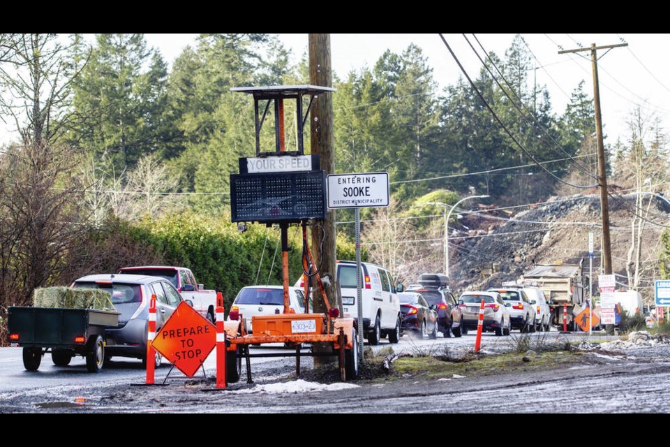 Traffic lines up outside the blasting zone on Sooke Road near 17 Mile House as groundwork starts for a new and improved 1.5-kilometre, four-lane stretch of Highway 14. DARREN STONE, TIMES COLONIST