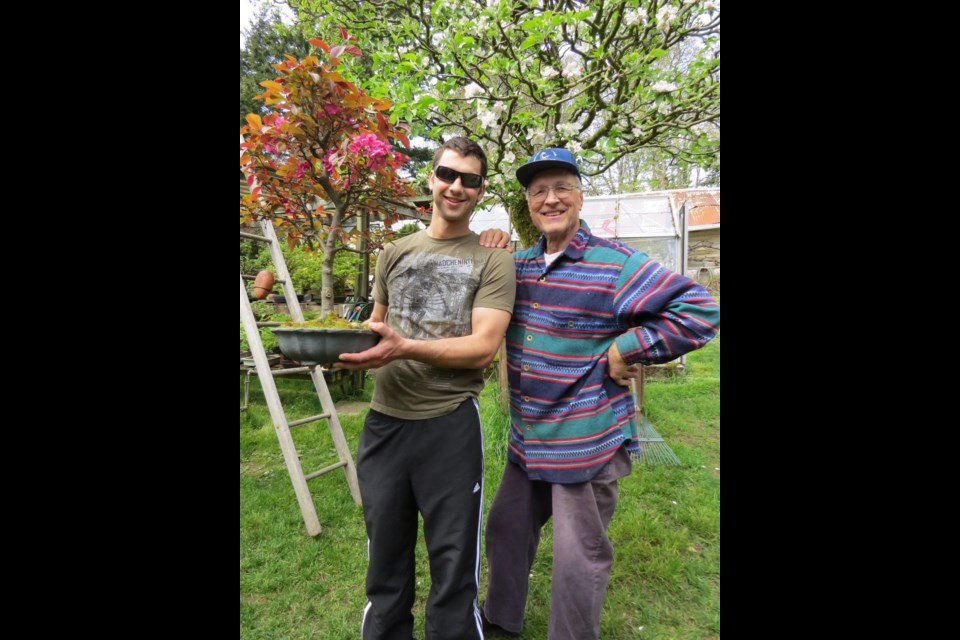 Darcy Rhodes with his grandfather and a bonsai maple. TAMARA DANIELLE