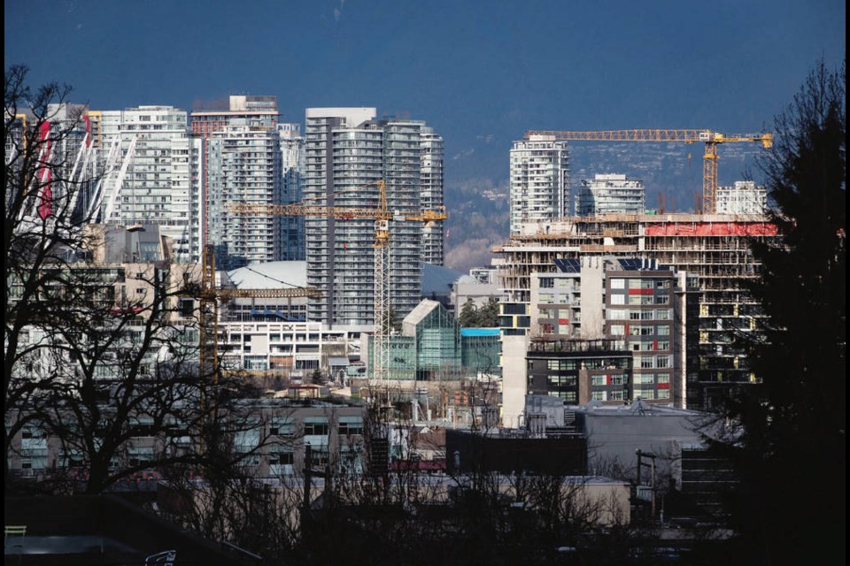 Construction cranes tower above condos under construction near southeast False Creek in Vancouver last year. Strata insurance prices have continued to escalate at an alarming pace since late 2019 as insurers fled B.C.s market. The province promised a slew of changes to deal with the rising cost, but most have yet to come into effect. THE CANADIAN PRESS