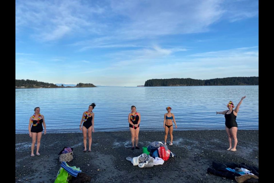 Ocean swimmers, from left, Liz Laidlaw, Kimiko Kika, Tanja Rumming, Gina Villares-Talbot and Lizzy Hannah pose just before they take their swim on International Womens Day in Departure Bay, Nanaimo. The five are part of a group that meets at 9 a.m. every Sunday to take a dip in the frigid waters. Gina Villares-Talbot