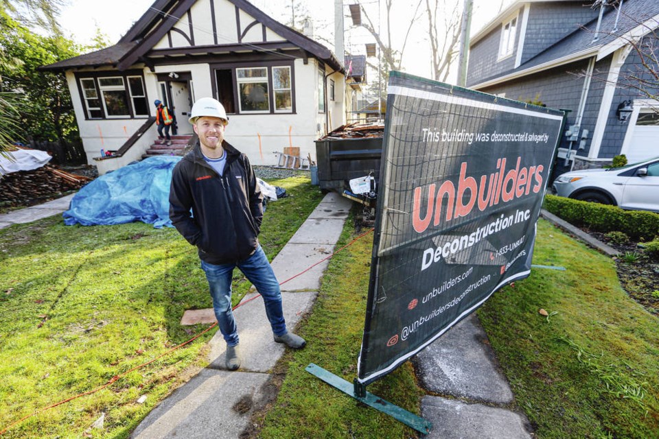 Adam Corneil, founder of Unbuilders, which takes apart and recycles housing components, at the site of an unbuild on Wilmot Place in Oak Bay. ADRIAN LAM, TIMES COLONIST