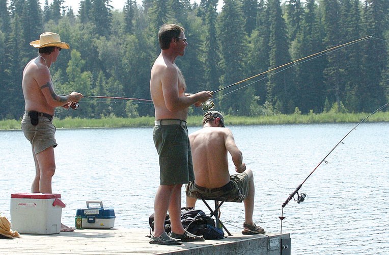 Dave Runge, Rodd Innes and Dave Douglas spent the afternoon fishing off the dock at the Ferguson Lake Nature Reserve in July 2012.