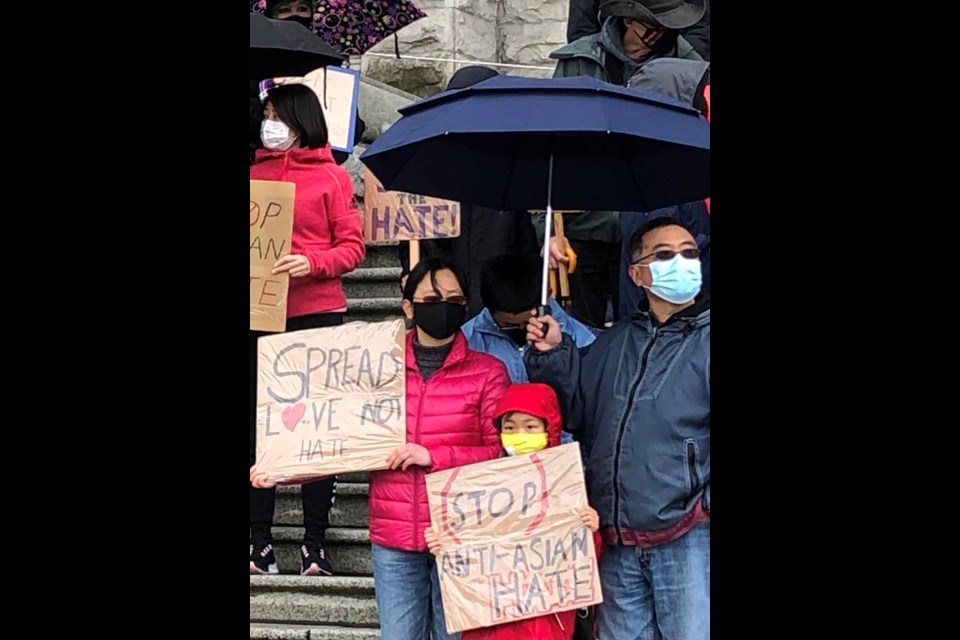 About 100 people gathered at the legislature on Sunday, March 28, 2021, to protest against anti-Asian racism. TIMES COLONIST