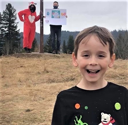 Five-year-old Micah Gagnon is all smiles as he poses for a photo, safely distanced from the elusive fox at Moore's Meadow, one of 25 destinations in the Most EGGcellent Cruise. The five-hour event Saturday afternoon drew close to 2,500 participants.