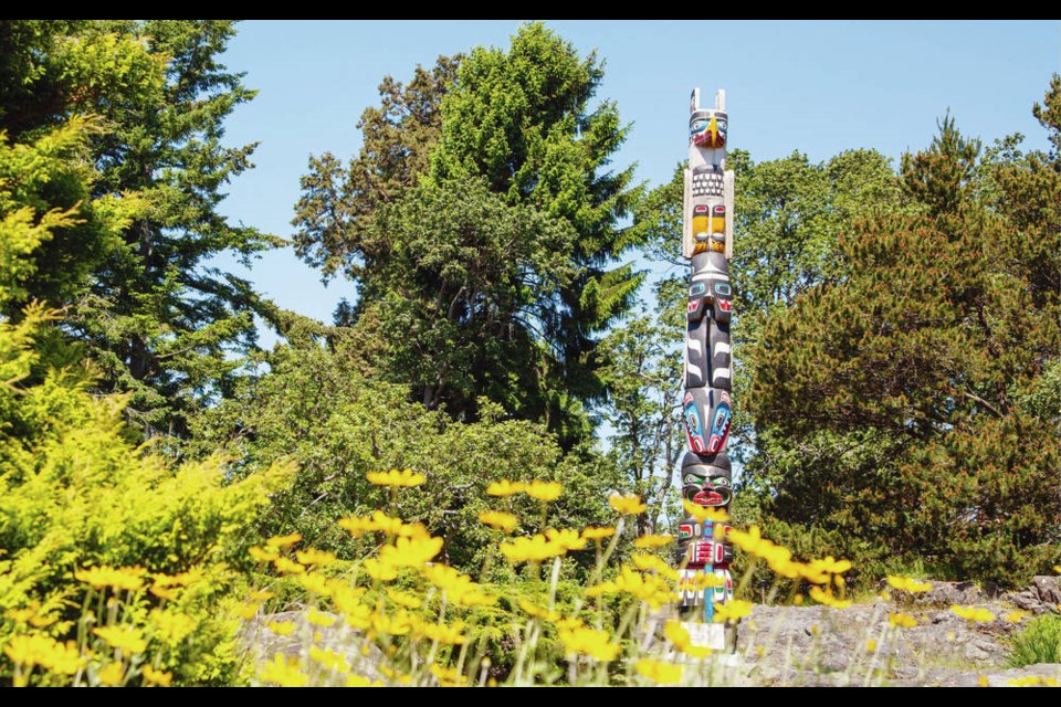 A replica of the Hosaqami totem pole, on display at Government House in June 2014. DEBRA BRASH, TIMES COLONIST