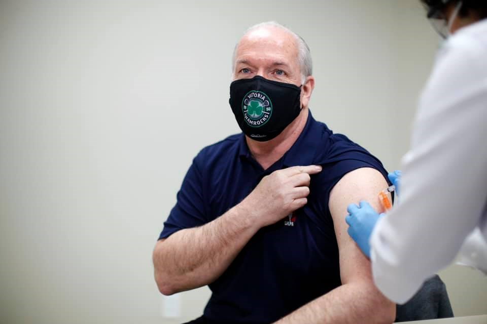 B.C. Premier John Horgan is seen at a pharmacy on April 16 receiving his first dose of the AstraZeneca vaccine. Horgan encouraged all who are eligible to get vaccinated as soon as possible.