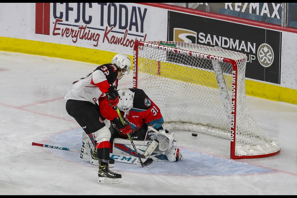 Prince George Cougars forward Fischer O'Brien scores his first career WHL goal on Kelowna Rockets goalie Cole Schwebius in the second period Saturday in Kamloops. The Cougars went on to lose 7-5 to the Rockets.