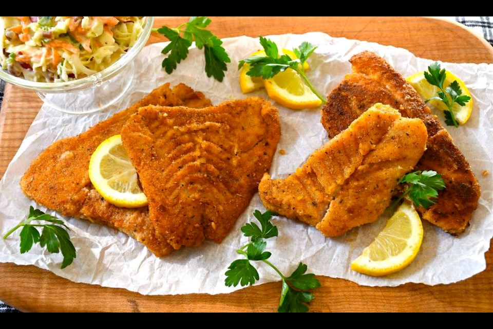 Cajun-style B.C. rockfish fillets are shallow fried in hot oil until rich golden. ERIC AKIS