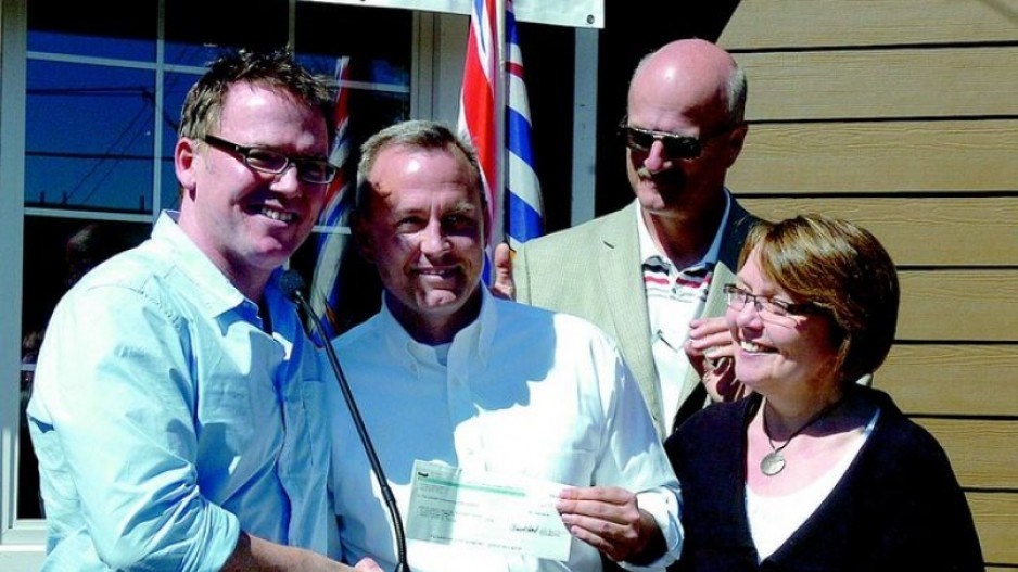 Baldy Hughes executive director Marshall Smith (white shirt) accepts a $500,000 donation from B.C. Liberal cabinet ministers Kevin Falcon, Pat Bell and Shirley Bond
