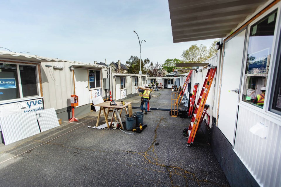 Construction continues at the Tiny Homes Village next to Royal Athletic Park, which will will provide temporary housing for 30 people currently living in city parks. DARREN STONE, TIMES COLONIST