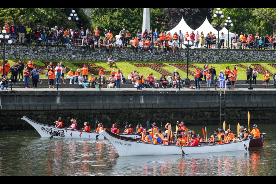 The Songhees and Esquimalt First Nations performed a Canoe Protocol in Victorias Inner Harbour, followed by prayers and a drum circle at the B.C. legislature on Tuesday to honour Indigenous children who attended residential schools. ADRIAN LAM, TIMES COLONIST