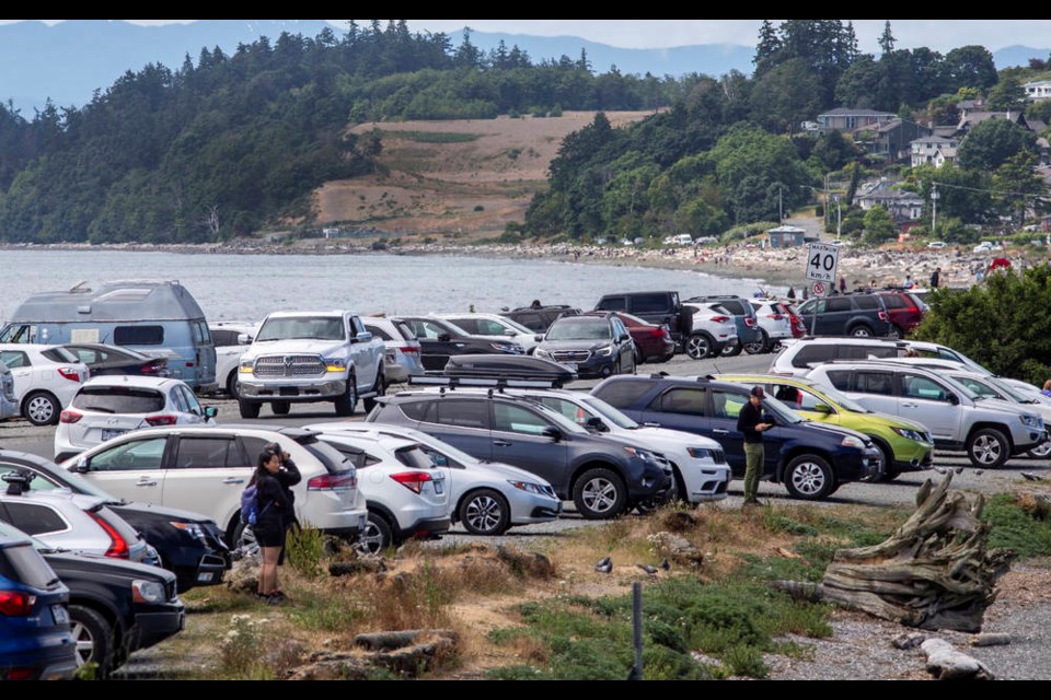 Parked cars line the sides of Ocean Boulevard on the Esquimalt Lagoon in Colwood on Saturday, June 19, 2021. Colwood council is expected to decide this month whether to close a portion of the boulevard for the summer as residents start looking at long-term plans for trails and access points to the city’s waterfront. DARREN STONE, TIMES COLONIST