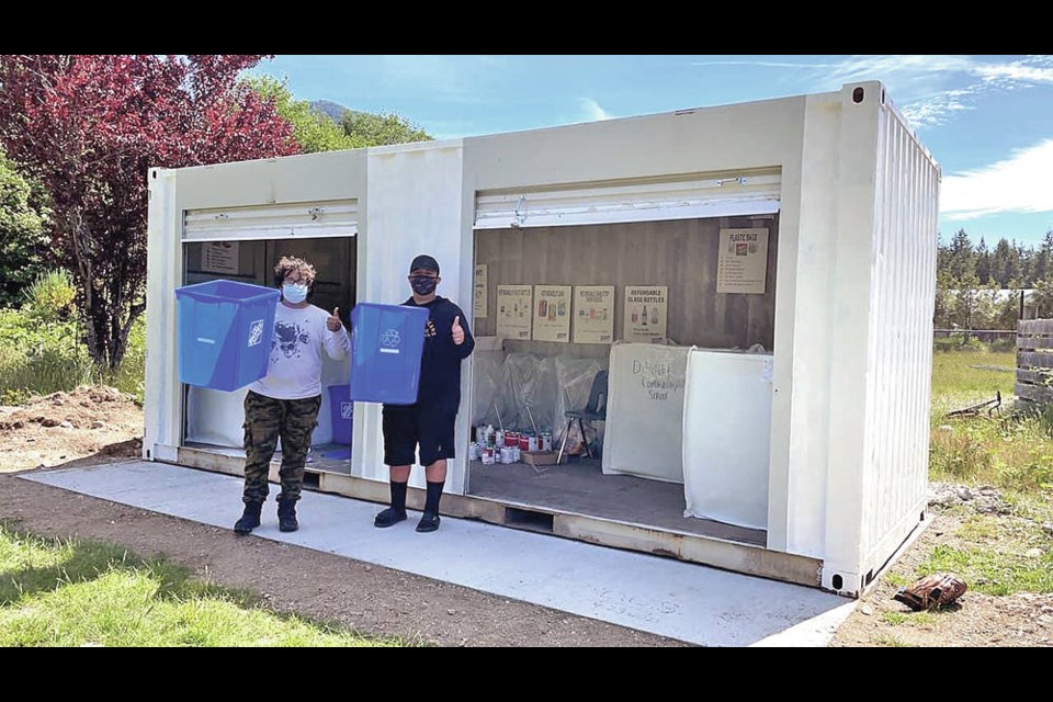 Mazzari Tate and Jimmy Joseph do a test run of sorting waste as they prepare for opening day for the community. KAILA PIDWERBESKI