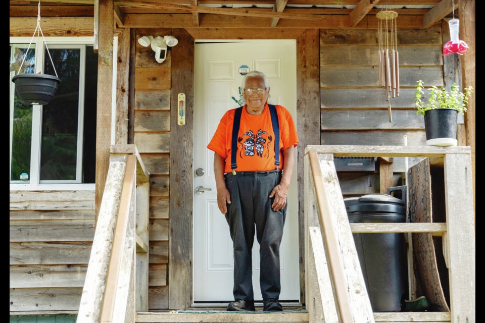 Elder Bill Jones stands on the porch of his home on the Pacheedaht First Nation. Jones has been an outspoken advocate for saving the remaining old-growth forests on his nations traditional territory. Norman Galimski