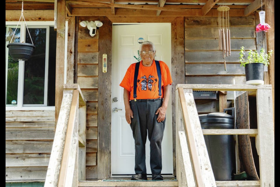 Elder Bill Jones stands on the porch of his home on the Pacheedaht First Nation. Jones has been an outspoken advocate for saving the remaining old-growth forests on his nations traditional territory. Norman Galimski
