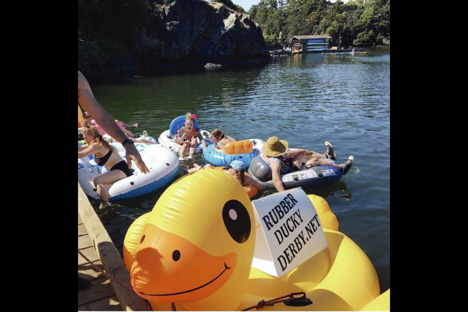 An oversized yellow duck inflatable promotes the ­Rubber Ducky Derby at the ­Banfield Park Dock on the Gorge ­Waterway. Thousands of ­rubber ducks will be dropped off the Craigflower Bridge for the event, set for Aug. 7.  Sandy Jacques