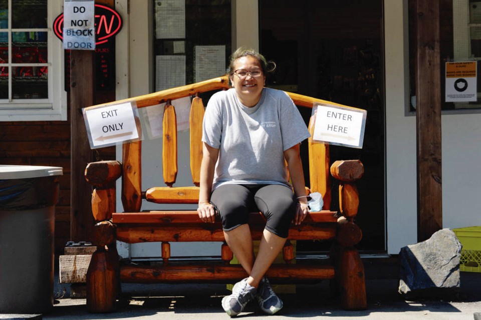 Nadine McClurg sits waiting for the next customer outside the Pacheedaht Gas Bar, now running into its third season in Port Renfrew. NORMAN GALIMSKI