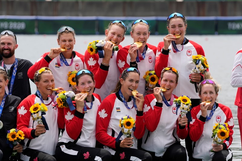 Gold medalists Lisa Roman, Kasia Gruchalla-Wesierski, Christine Roper, Andrea Proske, Susanne Grainger, Madison Mailey, Sydney Payne, Avalon Wasteneys and Kristen Kit of Canada pose during the medal ceremony for the women's rowing eight final lat the 2020 Summer Olympics, Friday, July 30, 2021, in Tokyo, Japan. (AP Photo/Lee Jin-man)