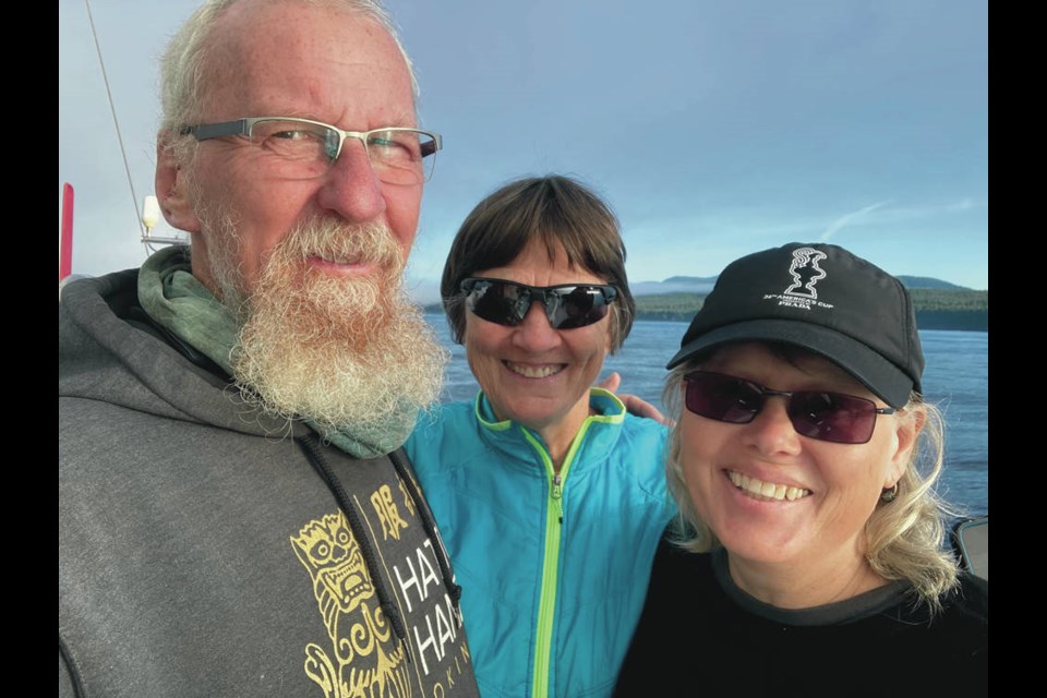 From left, Jean Baillargeon, Rhonda Scholar and Helen Roberts in quarantine on their 14-metre sloop, Shamata, anchored off Cadboro Bay. SUBMITTED