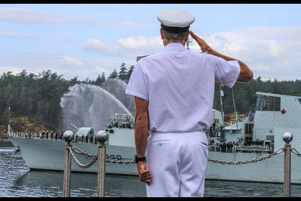 Rear Admiral Angus Topshee, commander of Maritime Forces Pacific, salutes from Duntze Head during the departure of HMCS Winnipeg on Tuesday, Aug. 17, 2021.  HMCS Winnipeg will be deployed in the Indo-Pacific region on Operation Projection and Operation Neon. ADRIAN LAM, TIMES COLONIST