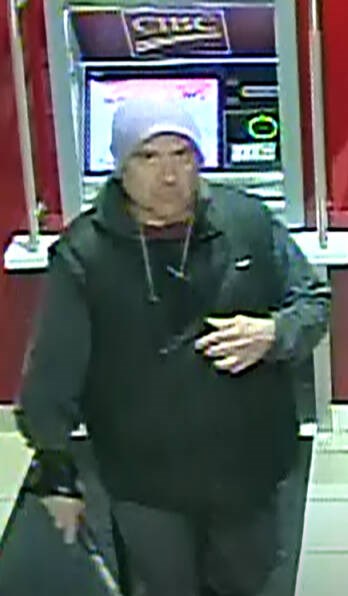 Oak Bay police are hoping to identify this man, who they say walked into two different Oak Bay banks about 11:30 p.m. on Sept. 1 and smashed the ATMs with a hammer before leaving. OAK BAY POLICE