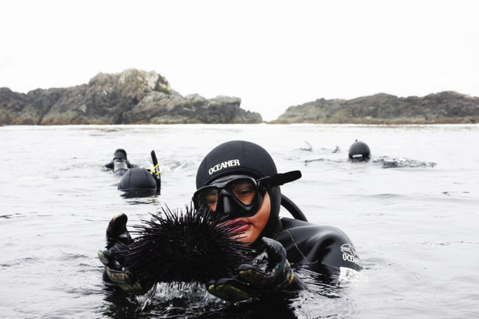 Jaidin Knighton holds a sea urchin while snorkelling along the Wild Pacific Trail in Ucluelet. Story, Page 2 MELISSA RENWICK, HA-SHILTH-SA