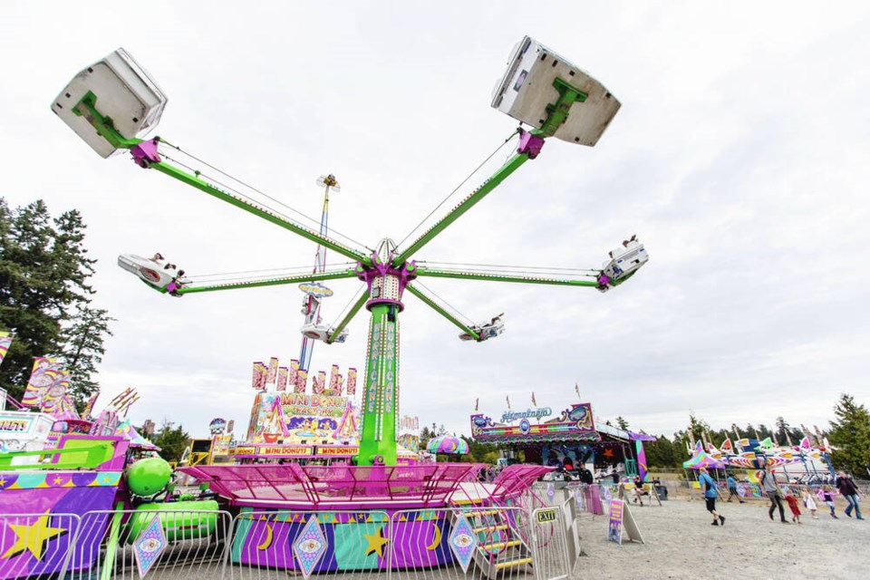 The Hurricane thrill ride soars over the 152nd Saanich Fair. DARREN STONE, TIMES COLONIST