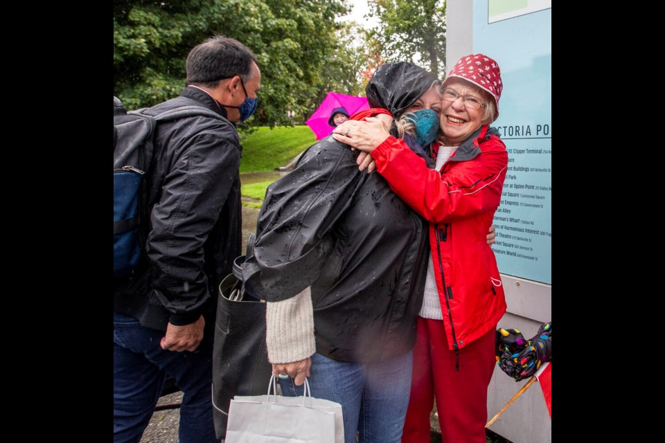 Marlene Lavallee hugs her son’s wife, Lee Ann Mangin, as son Paul Lavallee, left, looks on after the Clipper arrived in the Inner Harbour on Friday. DARREN STONE, TIMES COLONIST