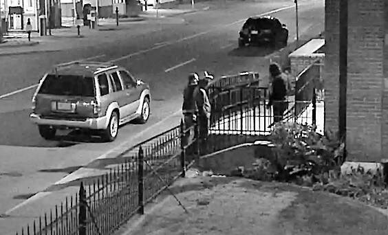 Video footage shows men suspected of damaging St. Andrews Cathedral at View and Blanshard streets on Sept. 12 talking to a witness. VICTORIA POLICE