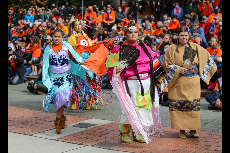 Tala Leon, left, Hazel Morris, Savannah Leon and Keisha Jones (back) dance during Truth and Reconciliation events at Centennial Square on Thursday. ADRIAN LAM, TIMES COLONIST
