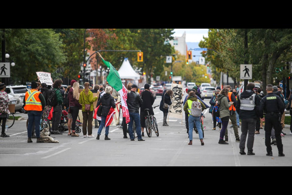 A group carrying signs in defence of First Nations land rights marched from Centennial Square to the 800-block of Yates Street Tuesday afternoon, causing traffic delays. ADRIAN LAM, TIMES COLONIST