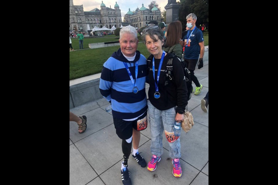 Jay Burnside and Michelle Marshall ran in the Royal Victoria 8K on Sunday. Burnside is just returning to running after losing her right leg in a medical procedure.   TIMES COLONIST   Oct. 10, 2021