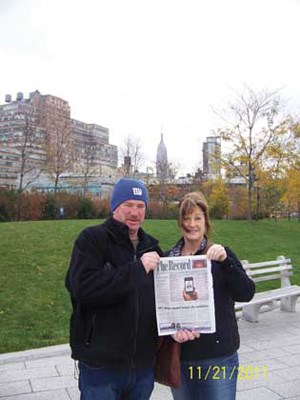 New York state of mind: Miles and Karen Schmidt enjoyed a New York moment while walking along the Hudson River's Chelsea Piers on a recent visit to New York with their son Jonny to celebrate his 18th birthday.