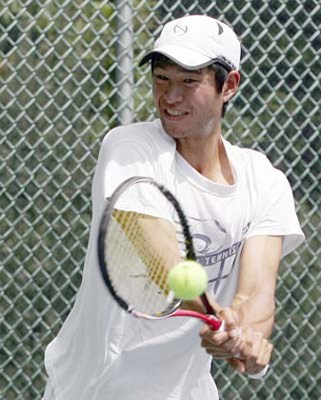 No. 1 down: Top seed Daniel Chu, in white, was defeated in straight sets by No. 4 and eventual finalist Jeremy Salvo of Coquitlam 6-4, 7-6 in the open men's singles semifinal at the Burnaby Open tennis championships on Saturday. Chu teamed up with brother David to win the open men's doubles.