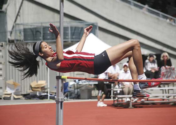 Up and over: Manisha Kandola easily clears the bar in the high jump at the Trevor Craven Memorial track and field meet at Swangard Stadium on Saturday.