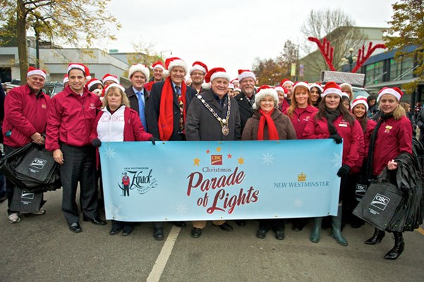 Ready to go: Mayor Wayne Wright and CIBC staff are ready for the CIBC Christmas Parade of Lights on the weekend.