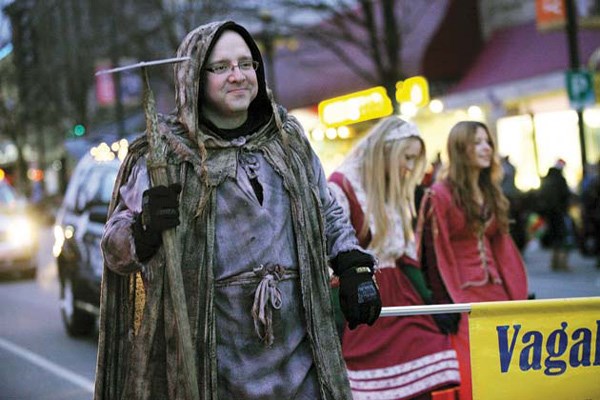 Playing around: A contingent from Vagabond Players donned costumes for the 2011 CIBC Christmas Parade of Lights on Columbia Street.